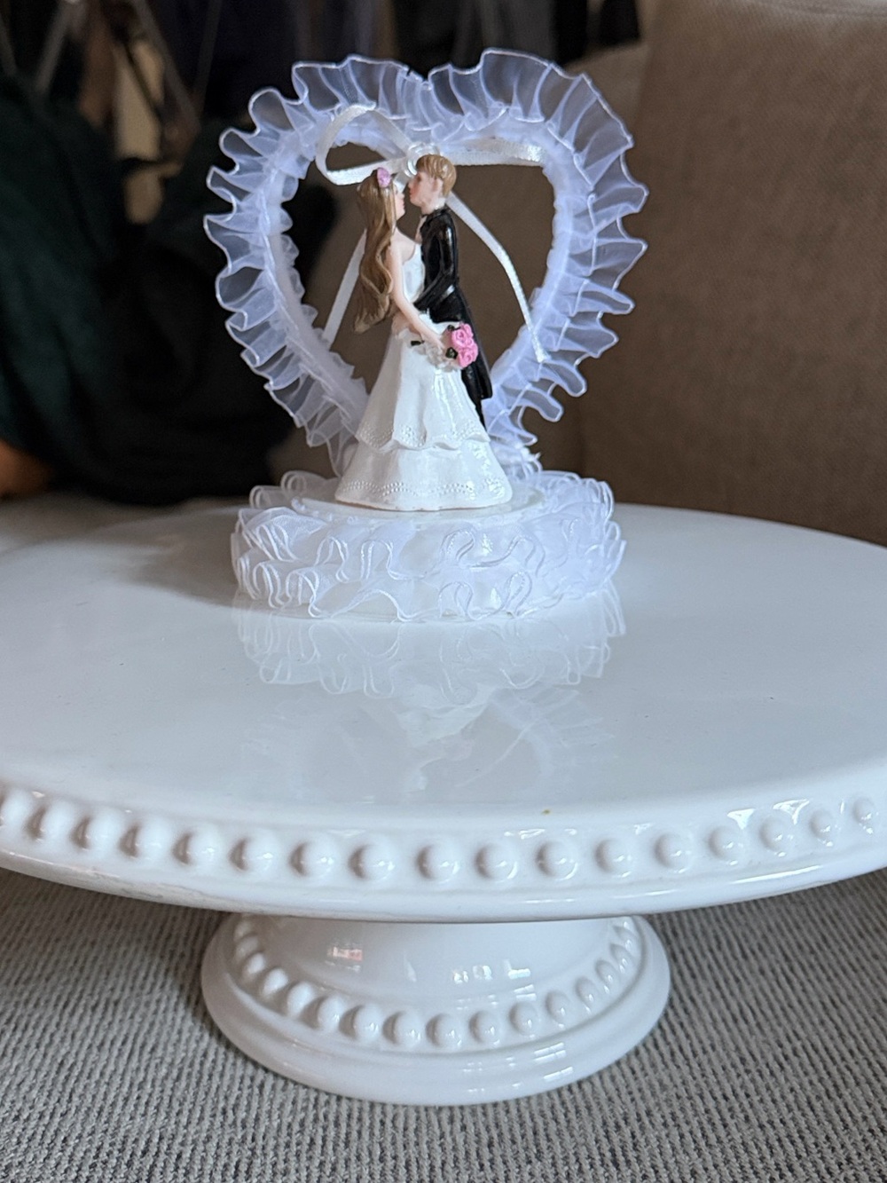 Vintage inspired wedding cake topper with bride and groom figurines